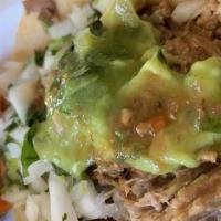 Tacos De Carnitas · Three roasted pork tip tacos with sauteed onions,cilantro,topped with cabbage and cheese. Se...