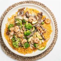 Peluza  · Steak, shrimp, chicken broccoli, onions, bell peppers and zucchini on a bed of rice topped w...