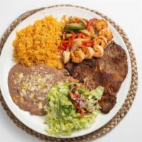 T-Bone With Shrimp  · T-bone with shrimp served with onions, bell pepper. Served with rice, beans and guacamole sa...