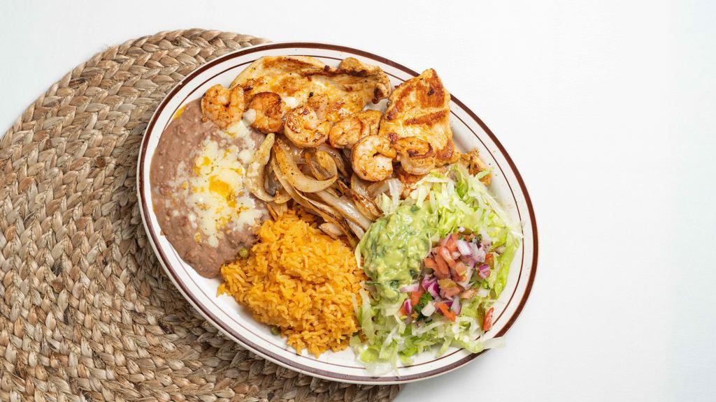 Chicken Breast With Shrimp · Perfectly grilled chicken breast and shrimp accompanied with onions. Served with rice, beans and tortillas.