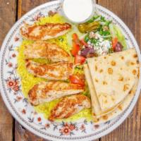 Chicken Platter · Grilled chicken served on top of rice, with your choice of lettuce, tomatoes, onions and cuc...