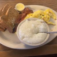 Hungry Man · Three eggs any style with sliced ham, two links, two bacon, home fries or grits and toast.