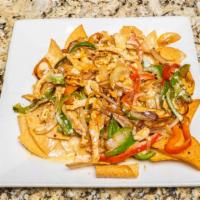 Fajita Nachos · Grilled steak or chicken sautéed with onions and bell peppers.