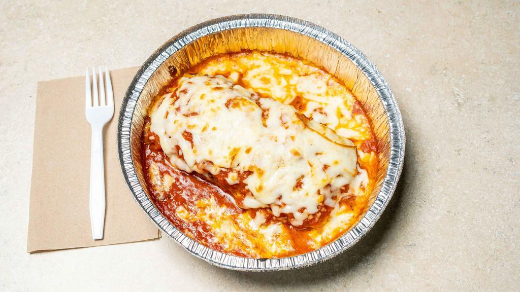 Lasagna With Meat
 · Lasagna topped with classic cheese, tomato sauce, and ground beef.