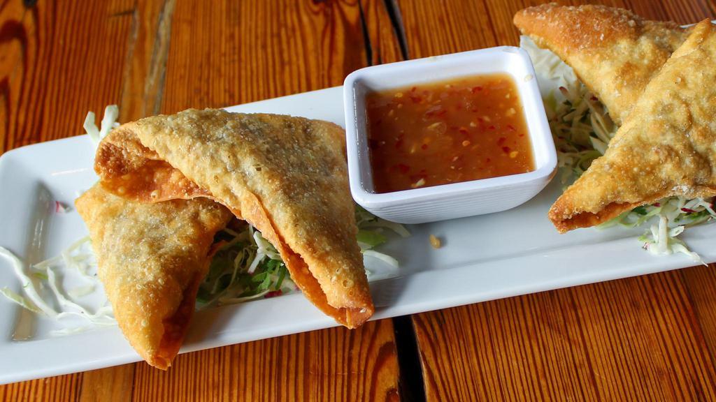 Spicy Chicken Samosas · Chicken, peppers, house-made pineapple sweet chili sauce