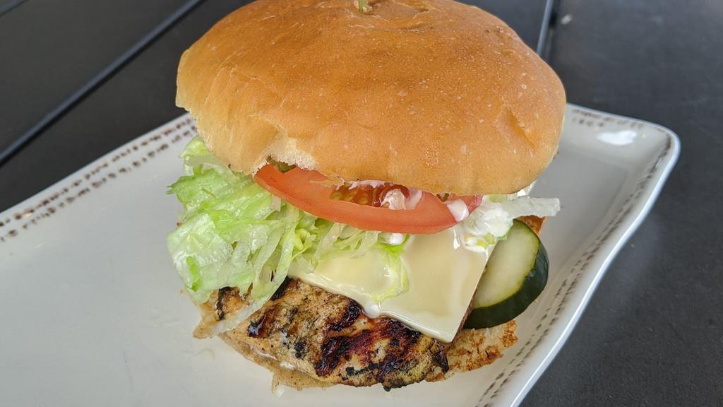 Grilled Chicken Sandwich · Grilled pineapple marinated chicken, tomato, iceberg lettuce, confusion sauce, Swiss-American cheese