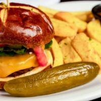 Pizza Burger · Beyond Meat burger served on a pretzel bun with Daiya Vegan Provolone, marinara topped with ...