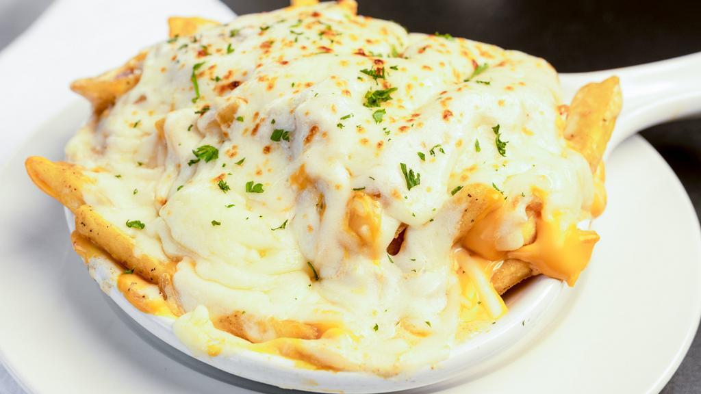 Zeus'S Fries · Godly steak cut fries topped with liquid gold, sauteed onions, mozzarella, cajun ranch and our garlic pepper seasoning.