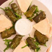 Grape Leaves · Vegan, Vegetarian. Stuffed with rice, parsley, onions. Served hot or cold with tzatziki and ...
