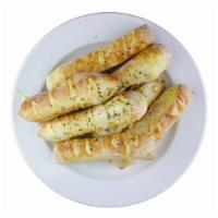 Breadsticks · 8 Breadsticks topped over with Parmesan Cheese and Garlic Butter!