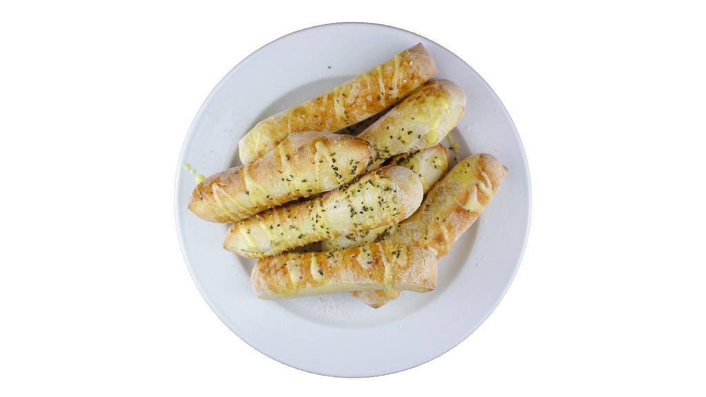 Breadsticks · 8 Breadsticks topped over with Parmesan Cheese and Garlic Butter!