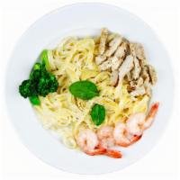 Fettuccine Alfredo · Fettuccine pasta smothered in creamy Alfredo sauce topped with mozzarella and parmesan chees...