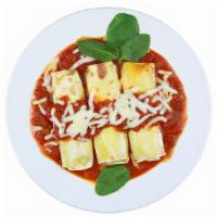 Cheese Manicotti · Pasta rolls stuffed with ricotta and mozzarella, topped with marinara sauce, and baked with ...