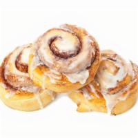 Cinnamon Rolls · Six rolls with icing on the top.