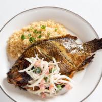 Attieke And Grilled Fish · Grilled/fried fish dressed with a homemade vinaigrette served with attieke or rice.