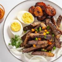Suya (Grilled Beef) · Grilled beef served with onions grilled or raw, sweet plantains, eggs, and spicy homemade sa...