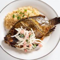 Attieke And Grilled Fish · Grilled Tilapia served w/cassava, onions and tomatoes, spicy sauce