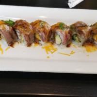 Mccain Roll · Crab with avocado, seared tenderloin, green onion and cheddar cheese, with white eel sauce.