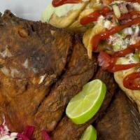 Fried Fish (Pescado Frito) · Marinated tilapia fish, fried to golden brown and served with fried plantain and salad
Pezca...