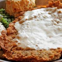 Chicken Fried Steak (Original) · A huge hand-breaded steak topped with country gravy and served with crisp fries and creamy c...