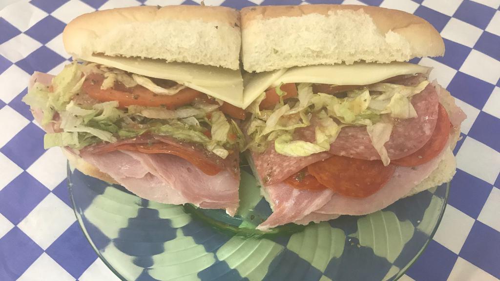 Italian Sub · Favorite. Fresh ham, salami, and pepperoni topped with provolone, green peppers, sliced tomatoes, lettuce, oregano and Italian Dressing.