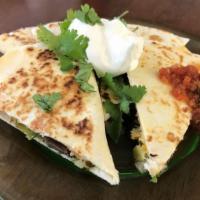 Mushroom & Cheese Quesadilla · Soft Tortilla grilled and stuffed with sliced mushrooms, Mexican & aged cheddar cheeses, gar...