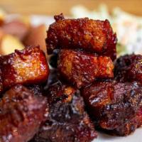 Cowboy Crack  · Slow-smoked, crispy pork belly tossed in a tangy, mild BBQ-hot sauce