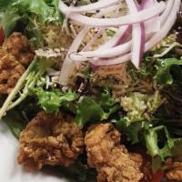 Crispy Gulf Oyster Salad · Juicy, fried gulf oysters on a bed of spring mix, tomato, sweet pickled purple onion; shredd...