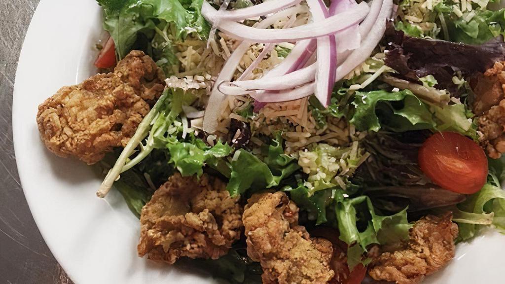 Crispy Gulf Oyster Salad · Juicy, fried gulf oysters on a bed of spring mix, tomato, sweet pickled purple onion; shredded colby and cheddar cheese; house made croutons; dillicious tobasco ranch.