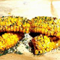 Cajun Street Corn  · Flash fried crawfish corn buttered and covered w/ Parmesan Romano cheese and mojito-lime sea...