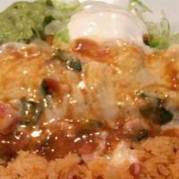 Super Burrito · choice of steak or grilled chicken stuffed with onions, bell peppers, tomatoes, cheese and b...