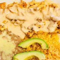 Pollo Chipotle  · Chicken strips covered in a creamy chipotle sauce, served with rice, beans and avocado slices.