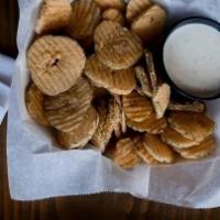 Skinny Pickles · A hefty portion of dill pickle chips served with ranch for dipping. Add fried jalapeño for m...
