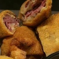 Reuben Eggrolls · Corned beef, saurkraut, and swiss cheese rolled up and deep fried. Served with 1000 island f...