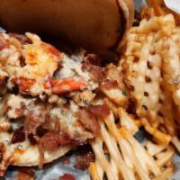 Surf & Turf Burger · Juicy 8 0z burger, marinated lobster, crispy bacon, cilantro creme, mixed chzzz, on brioche ...