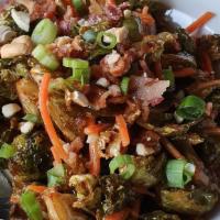 Brussels Dilemma · Brussel sprouts fried and tossed in a savory miso, bean sprouts & cashews with bacon or no b...