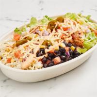 Bowl · Your choice of slow-cooked meats, white rice, and beans. Toppings include romaine lettuce, t...