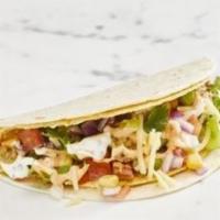 Dos Capas · A crunchy taco shell wrapped in a warm soft tortilla with your choice of slow-cooked meats. ...