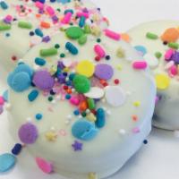 Chocolate Dipped Oreos · A three pack dipped in our signature chocolate topped with signature sprinkles.