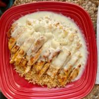C.P. · Grilled chicken with Spanish rice and smothered with cheese dip. Tortillas on the side.