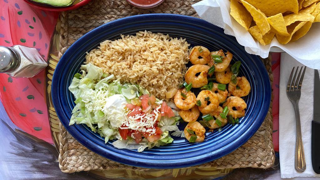 Camarones Al Mojo De Ajo · Shrimp served with exquisite Mexican garlic sauce, onions, Spanish rice, and salad.