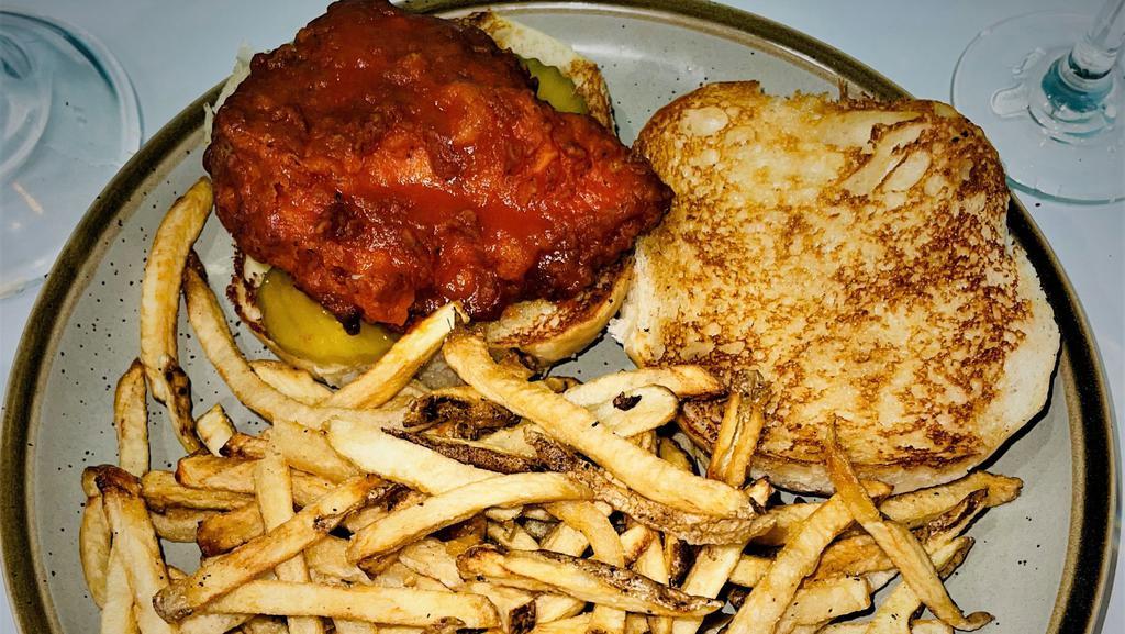 Buffalo Chicken Sandwich · Grilled or fried chicken breast tossed in Buffalo sauce with lettuce, tomato, onion, pickle, on a sourdough bun. Served with fries.