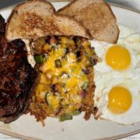 Steak & Eggs · Seasoned and seared (10oz.) ribeye, 2 eggs, loaded hashbrowns, and wheat toast.