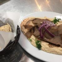 Lulu Hummus · Homemade hummus topped off with your choice of chicken shawarma, lamb, or gyro meat. Served ...