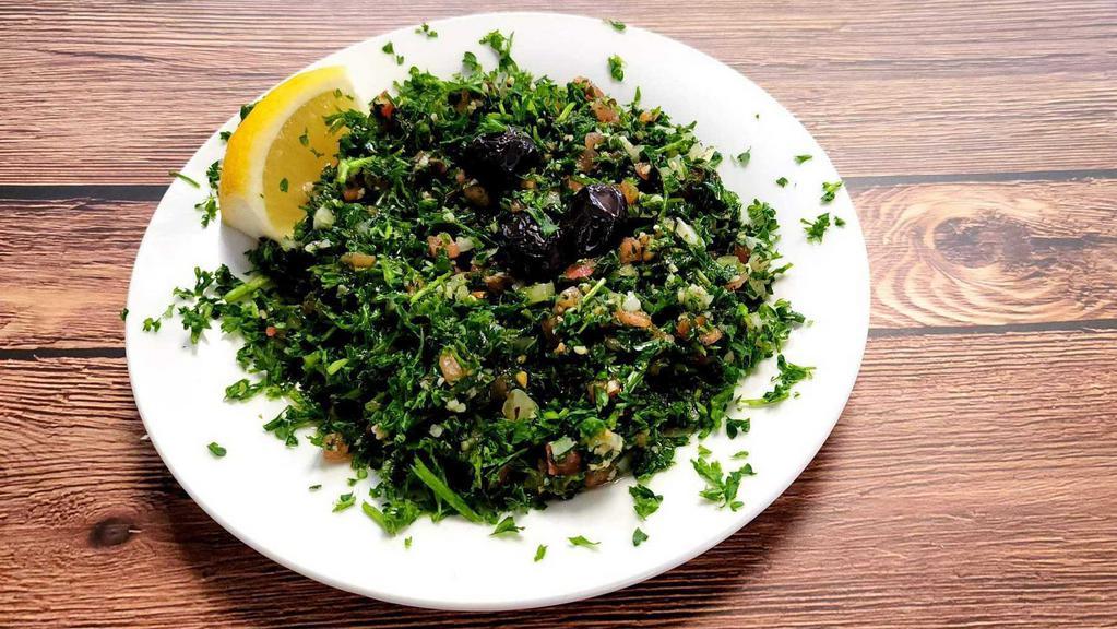 Tabouli Salad · Vegetarian. Cracked wheat mixed with parsley, mint, green onion, and tomato. Seasoned with olive oil and fresh lemon. Served with pita bread.