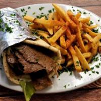 Gyro Pita · Sliced beef and lamb gyro over lettuce, tomato, red onion and grecian sauce. Served with you...