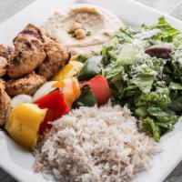Chicken Kabab · Marinated grilled chicken breast kabab. Served with feta cheese salad, rice, hummus, and pit...