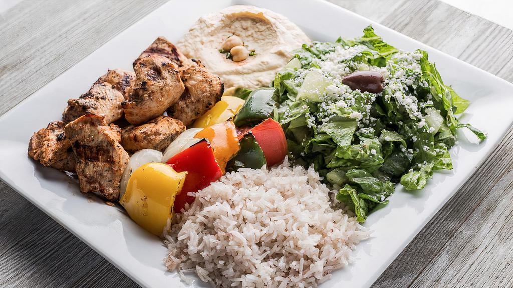 Chicken Kabab · Marinated grilled chicken breast kabab. Served with feta cheese salad, rice, hummus, and pita bread.