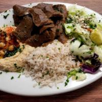 Gyro Plate · Sliced beef and lamb gyro meat. Served with feta cheese salad, rice, hummus and pita bread.