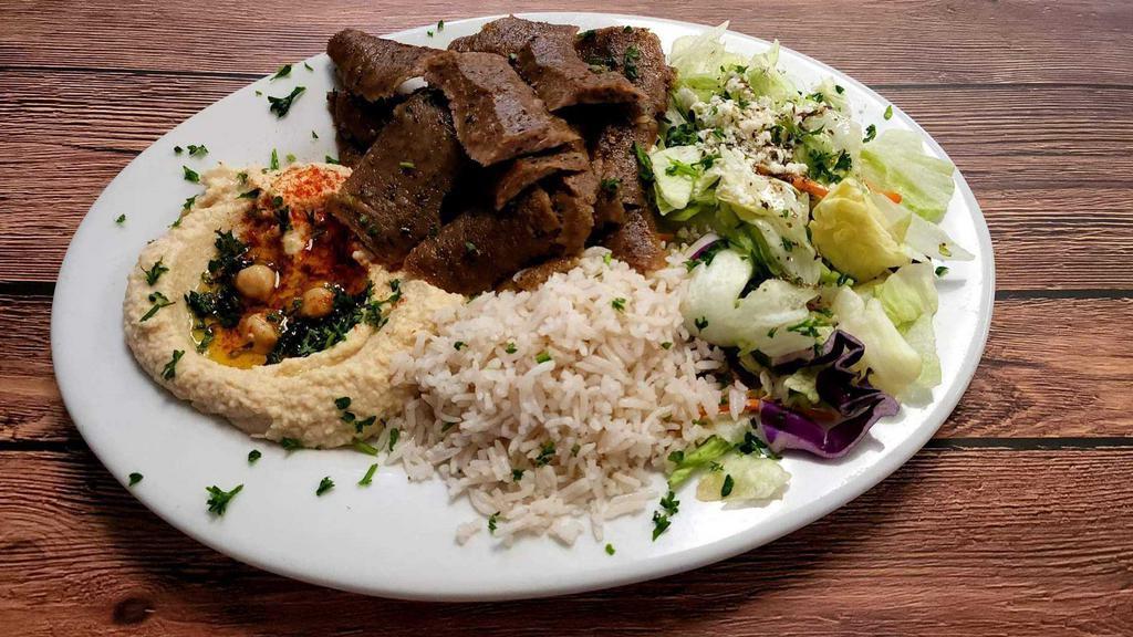 Gyro Plate · Sliced beef and lamb gyro meat. Served with feta cheese salad, rice, hummus and pita bread.